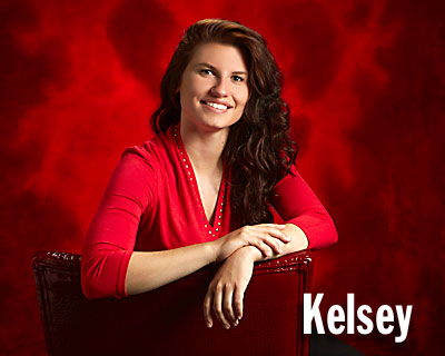 Studio One senior picture of girl on red chair