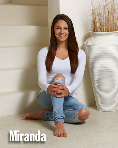 Studio One Senior Picture of girl in torn jeans