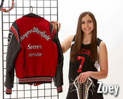 Studio One senior photo of girl in sports uniform